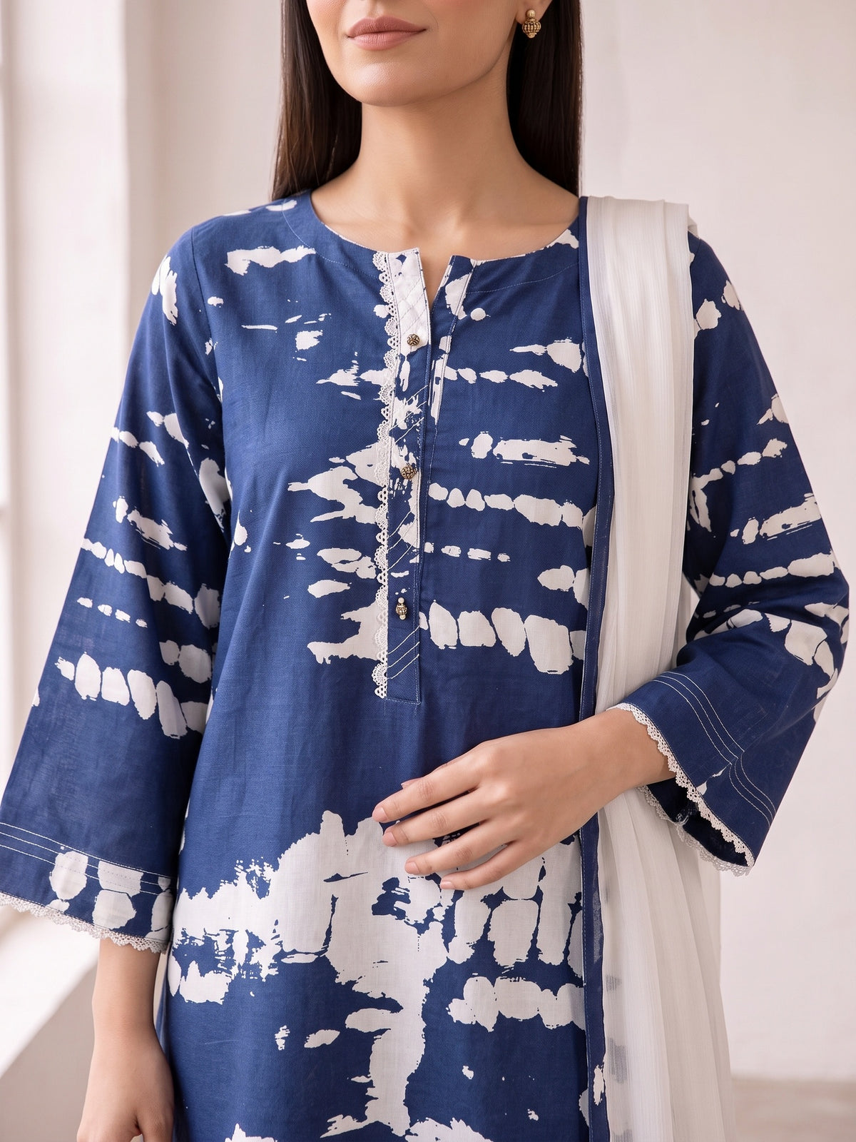 Blue and white tie-dye linen shirt placket close-up
