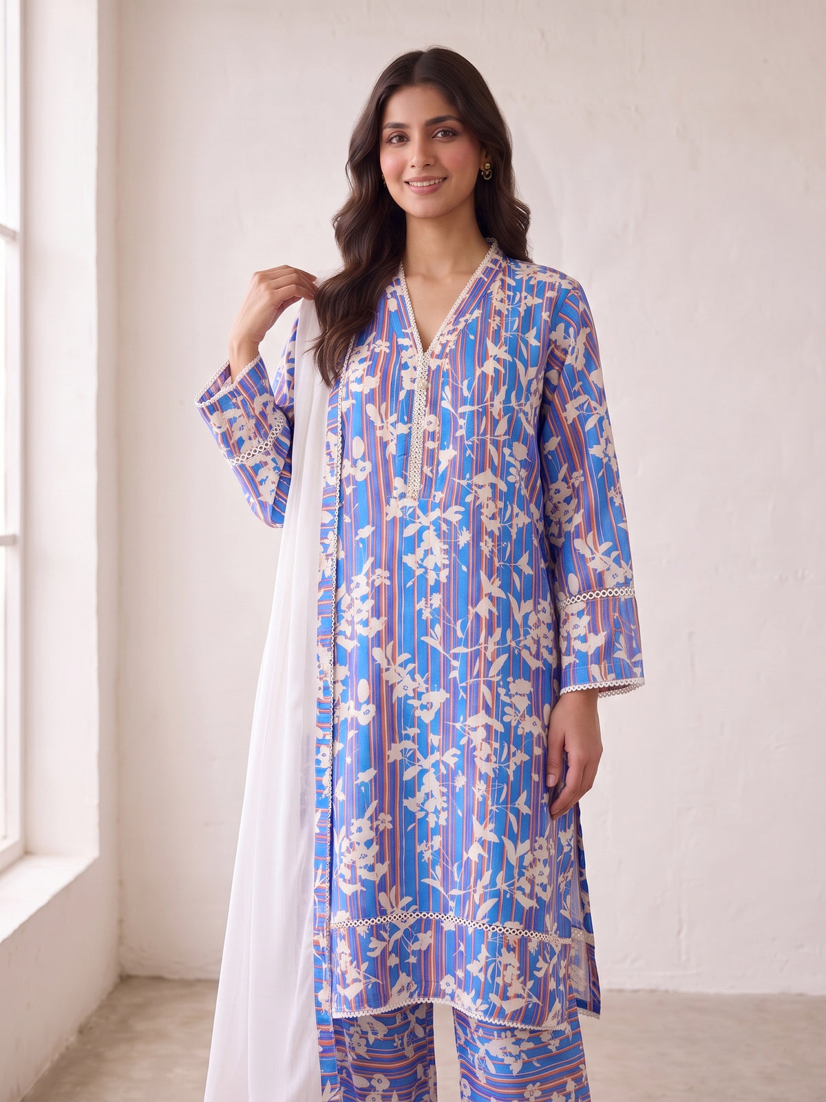 Cobalt blue linen suit showing sleeve and hem lace detail