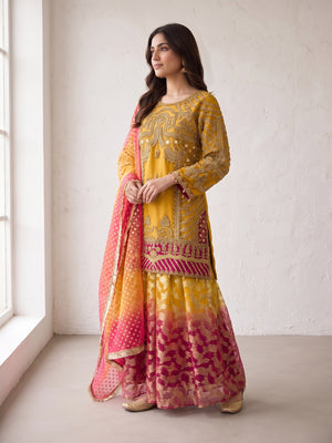 Mustard embroidered net suit with sharara - angled view